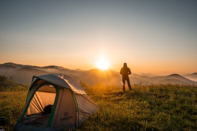 People camping in nature at sunset